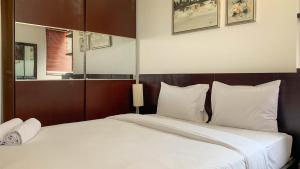 Comfort and Minimalist 2BR at Maple Park Sunter Apartment By Travelio