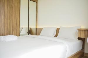 Fully Furnished with Modern Design 2BR at Sky House BSD Apartment By Travelio