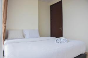 Spacious and Elegant 3BR at Menteng Park Apartment By Travelio