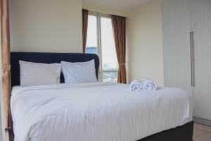 Spacious and Elegant 3BR at Menteng Park Apartment By Travelio