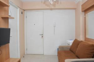 Comfortable 2BR Apartment at Bassura City By Travelio