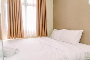 Nice and Elegant 2BR at Serpong Greenview Apartment By Travelio