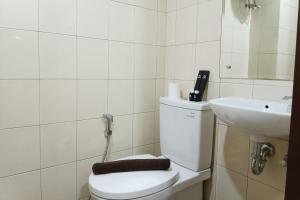 Homey and Tidy Studio Apartment at Vida View Makassar By Travelio