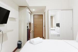 Homey and Tidy Studio Apartment at Vida View Makassar By Travelio