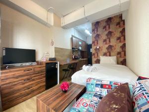 Scandinavian Studio Room at Grand Asia Afrika Apartment By Travelio