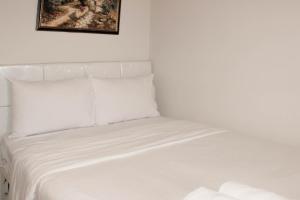 Minimalist and Homey 1BR at Bassura City Apartment By Travelio