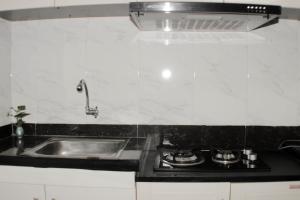 Minimalist and Homey 1BR at Bassura City Apartment By Travelio