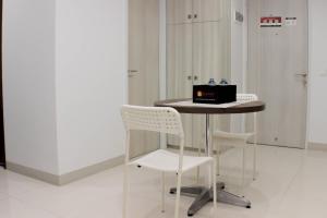 Comfort and Minimalist Studio at Azalea Suites Apartment By Travelio