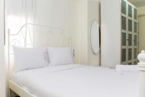White and Nice 1BR at Bassura City Apartment By Travelio