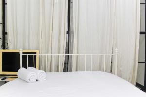 White and Nice 1BR at Bassura City Apartment By Travelio