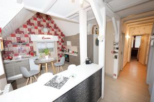 Appartements Le clocher aux cigognes au village de Bergheim : photos des chambres