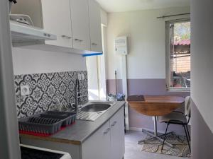 Appartements Petite maison cosy au fond du jardin : photos des chambres