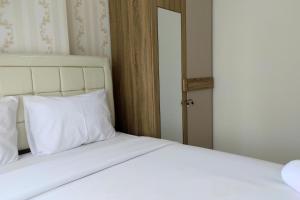 Simply and Clean 2BR Apartment at Vida View Makassar By Travelio