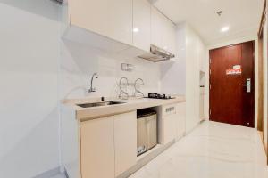 Cozy Stay and Simply Studio at Sky House BSD Apartment By Travelio