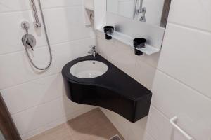 Good Designed and Cozy Studio at Sky House BSD Apartment By Travelio