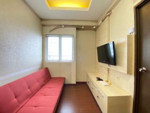 Cozy and Spacious 2BR at Suites @Metro Apartment By Travelio