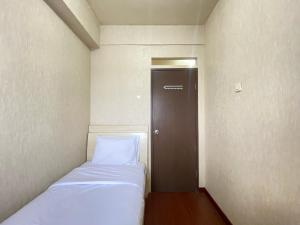 Cozy and Spacious 2BR at Suites @Metro Apartment By Travelio