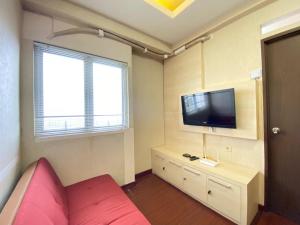 Cozy and Spacious 2BR at Suites @Metro Apartment By Travelio