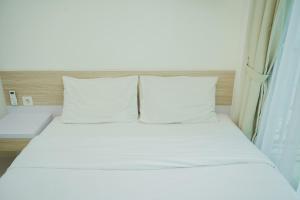 Comfy and Nice Studio at Tree Park City BSD Apartment By Travelio