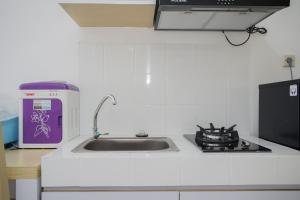 High Floor and Minimalist Studio Room at M-Town Residence Apartment By Travelio