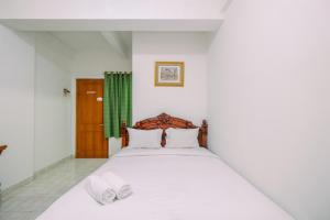 Cozy and Homey Studio Apartment at Margonda Residence 1 By Travelio