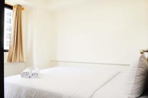 Spacious and Bright 2BR at Meikarta Apartment By Travelio