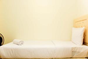 Spacious and Bright 2BR at Meikarta Apartment By Travelio