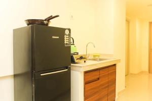 Spacious and Bright 2BR at Meikarta Apartment By Travelio