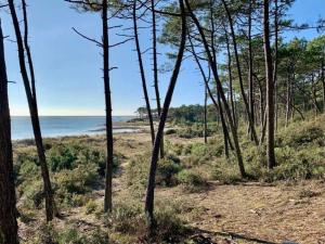 "AU BORD DU LAC" Appartement 4 personnes, village vacances, vue lac, accès parc aquatique