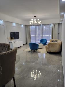 executive cozy apartment with fully equipped gym heated swimming pool and amazing scenic city views and ample parking and children playing ground