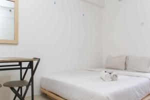 Simple and Cozy Living Studio Room at Bassura City Apartment By Travelio