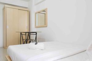 Simple and Cozy Living Studio Room at Bassura City Apartment By Travelio