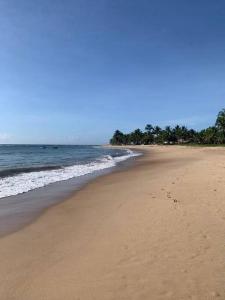 Casa Turquesa Pé na areia Piscina infinita Pet friendly Condomínio fechado