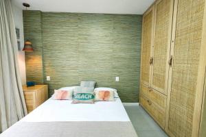 Casa Turquesa Pé na areia Piscina infinita Pet friendly Condomínio fechado