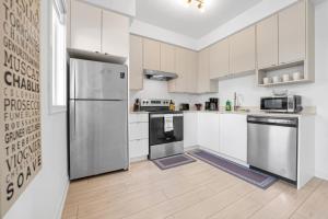 Posh 4 Bed Home with Backyard in Great Location