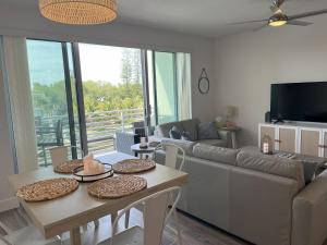 Luxury 2 Bed 2 Bath Waterfront Condo with Patio Sunsets Gym and Parking