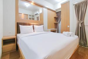 Minimalist and Homey Studio at Amartha View Apartment By Travelio