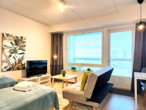 Kotimaailma Apartments - Kaunis 10 kerroksen parvekkeellinen yksiö - Peltokatu