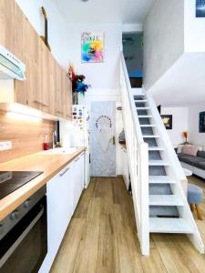 Maisons de vacances Charmante petite maison avec jardin : photos des chambres