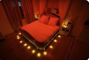 Appartements Love room avec spa privatif : photos des chambres