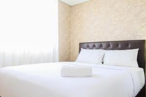 Comfort and Spacious 2BR Apartment at Tuscany Residence BSD City By Travelio