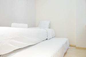 Fully Furnished with Elegant Design 2BR Bassura City Apartment By Travelio