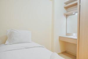 Fully Furnished with Elegant Design 2BR Bassura City Apartment By Travelio