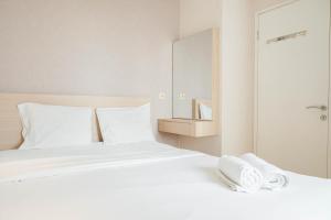 Fully Furnished with Elegant Design 2BR Bassura City Apartment By Travelio