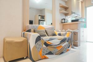 Fully Furnished with Elegant Design 2BR Bassura City Apartment By Travelio