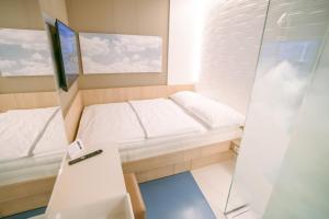 Economy Single Room Day Use ( 8 am- 8 pm) room in MY CLOUD Transit Hotel - Guests with international flight only!