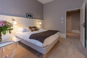Appartements La Maison Blanche - AppartHotels de charme Chic & Cosy a 350m du coeur de ville de Limoges - Acces autonome : photos des chambres