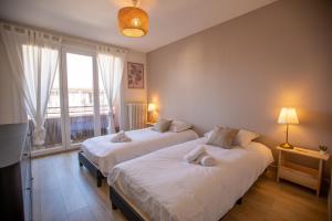 Appartements Le Cygne - vue montagne - proche du centre ville : photos des chambres