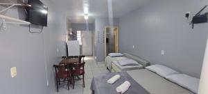 Estúdios Individual na Meia Praia ar, wifi, vaga, cozinha, tv smart - 6 x no cartão sem juros