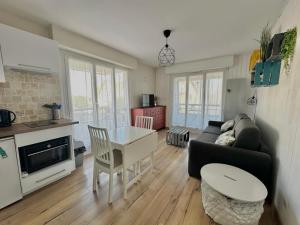 Appartements Le petit Courseulles - entre le port et la mer : photos des chambres